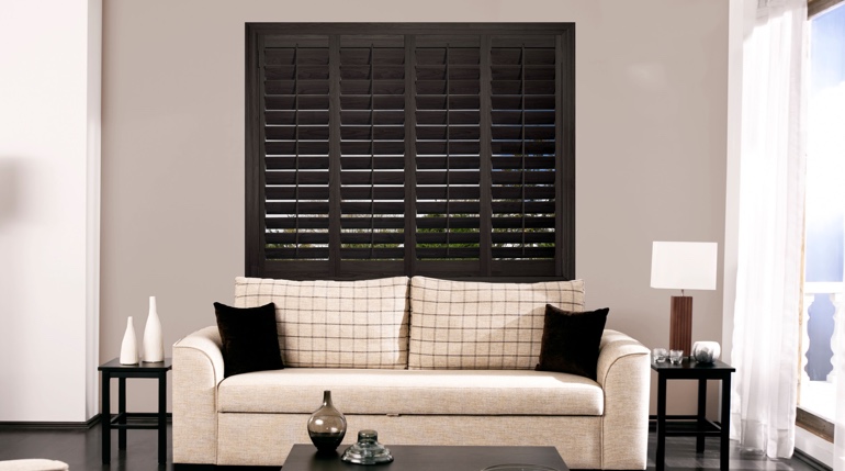 Southern California sunroom with stained wood shutters.